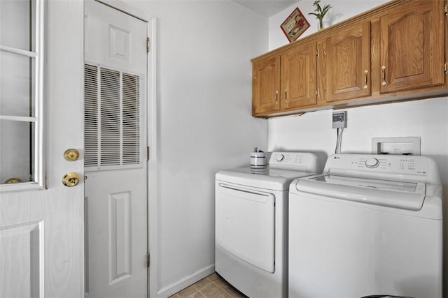 washroom with light tile patterned floors, cabinet space, and separate washer and dryer