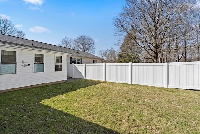 view of yard with a fenced backyard