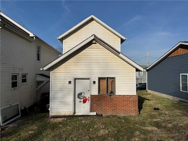 rear view of house with a lawn