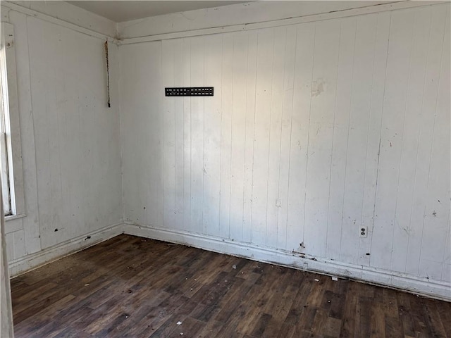 empty room with wood-type flooring