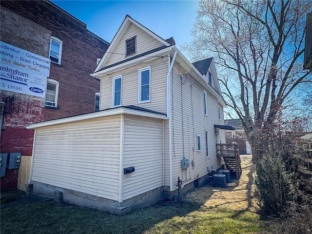 rear view of house featuring crawl space