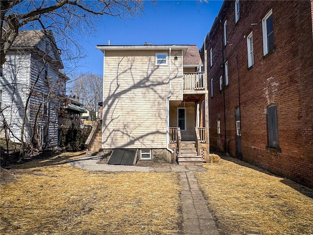 rear view of house with a balcony