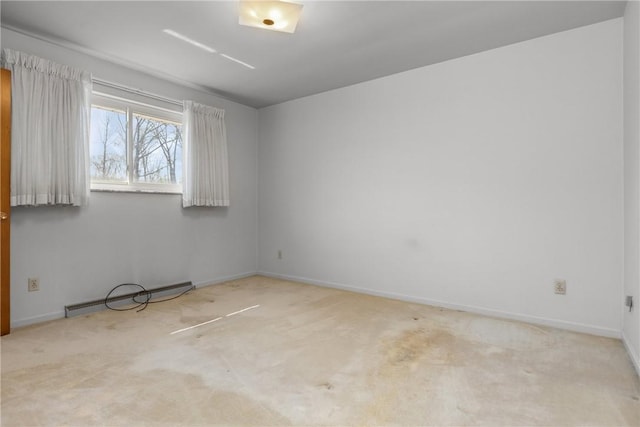 carpeted empty room with baseboards and baseboard heating