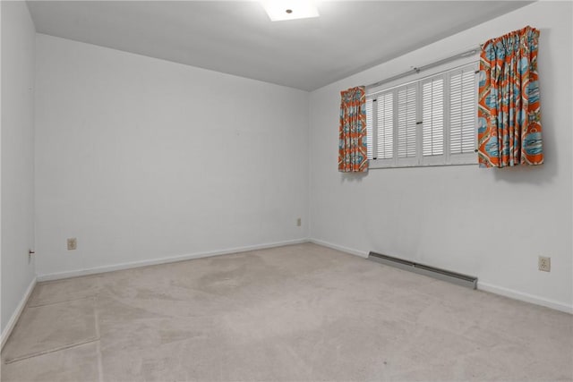 carpeted empty room with baseboards and a baseboard radiator