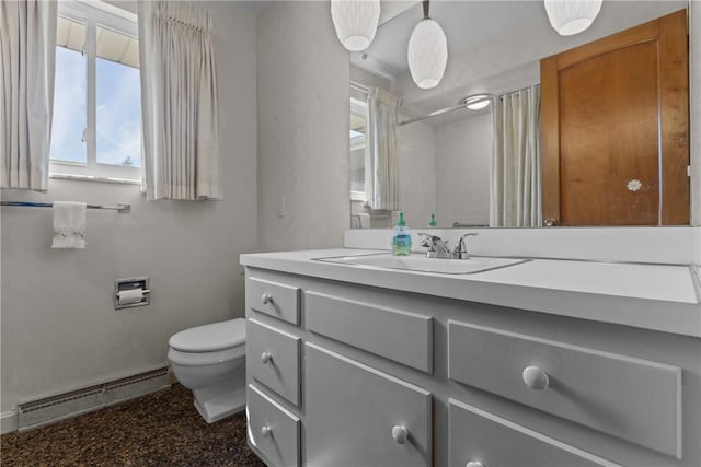 bathroom with toilet, vanity, a shower with curtain, and a baseboard radiator