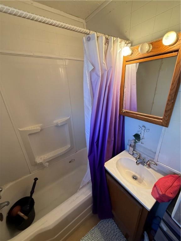 full bath with vanity and shower / bath combination with curtain