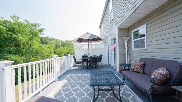 exterior space featuring an outdoor living space and outdoor dining area