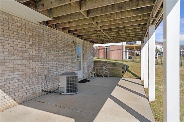 view of patio with fence and central AC unit
