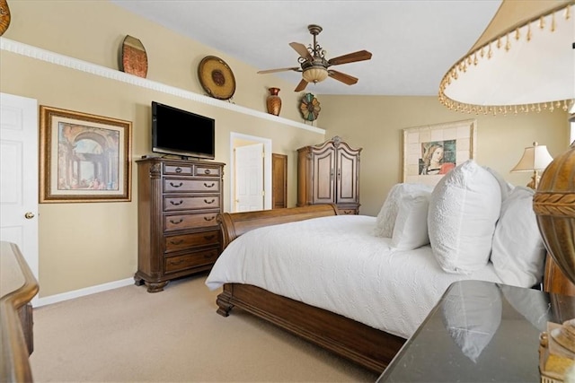 carpeted bedroom featuring a ceiling fan, lofted ceiling, and baseboards