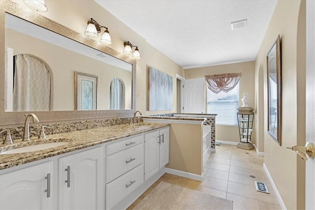 full bath featuring tile patterned floors, visible vents, and a sink