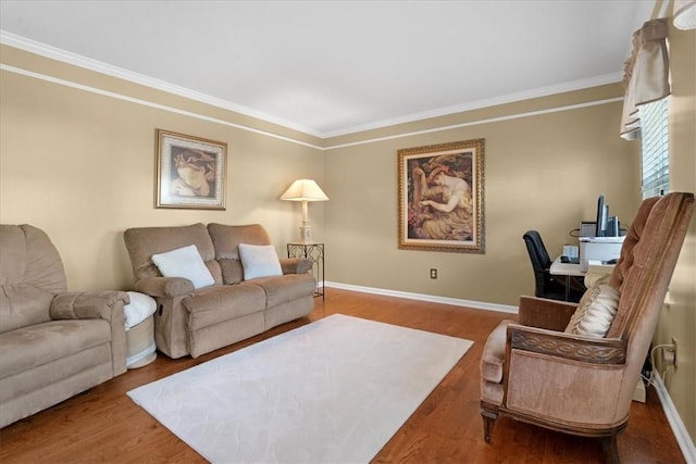 living room featuring baseboards, wood finished floors, and ornamental molding