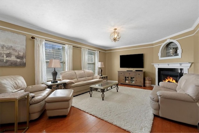 8004 Maureen Dr, Cranberry Twp, PA 16066 - living area with wood finished floors, ornamental molding, and a warm lit fireplace