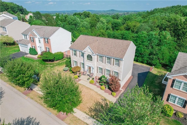 bird's eye view with a residential view and a view of trees