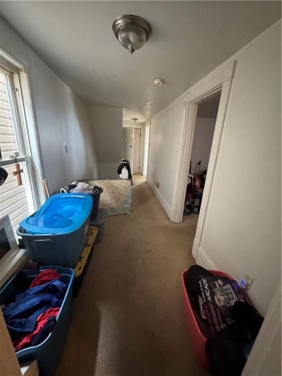 interior space with carpet flooring and baseboards