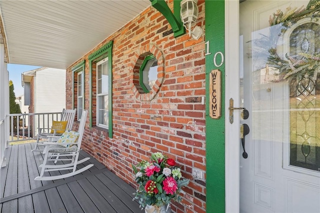 wooden deck featuring covered porch