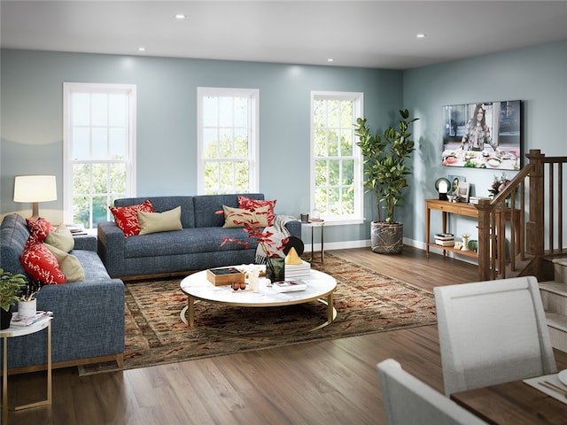 living room featuring recessed lighting, baseboards, and wood finished floors