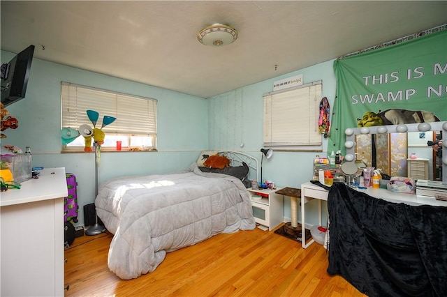 bedroom with wood finished floors