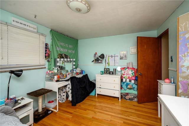 bedroom with light wood-type flooring