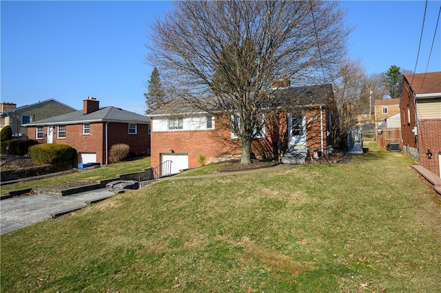 view of yard with a garage and fence