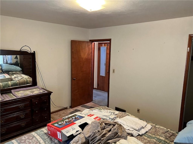 bedroom with light colored carpet