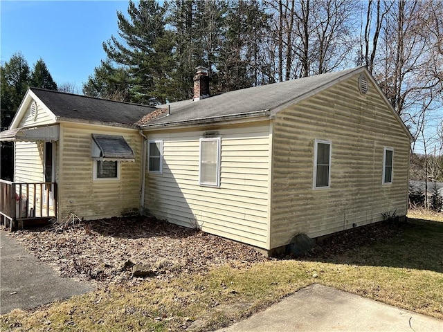 4 Woodbine Dr, Hempfield Twp Mer, PA 16125 - view of home's exterior featuring a chimney, a yard, and a shingled roof
