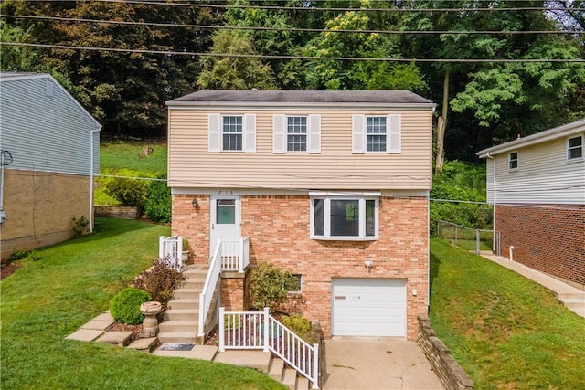 colonial-style house with brick siding, a garage, driveway, and a front yard