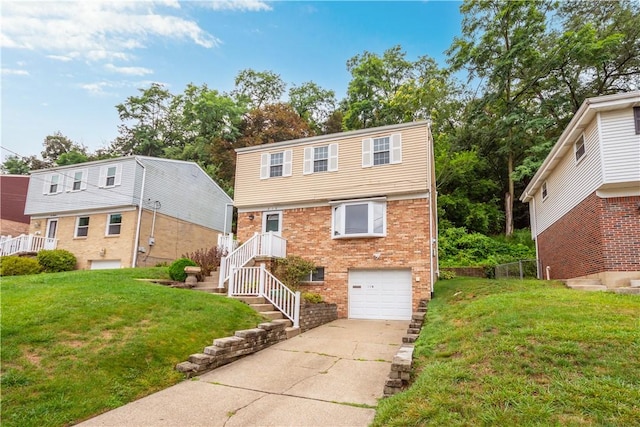 colonial home featuring brick siding, a front lawn, concrete driveway, and an attached garage