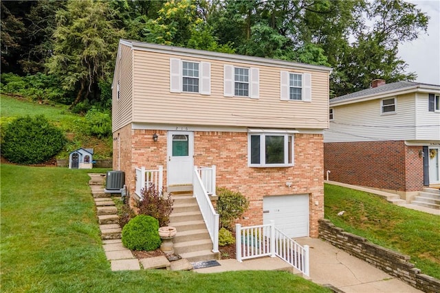 view of front of house featuring driveway, central AC, a front lawn, a garage, and brick siding