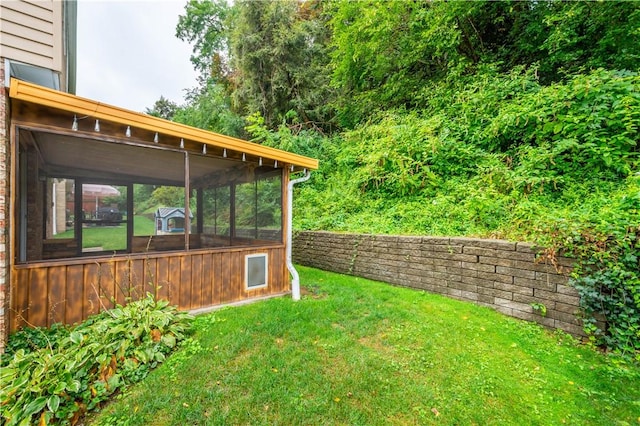 view of yard with a sunroom