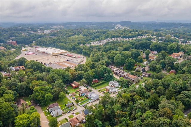 birds eye view of property with a forest view