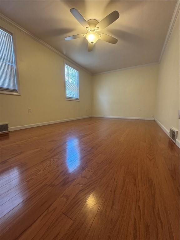 spare room featuring visible vents and ornamental molding