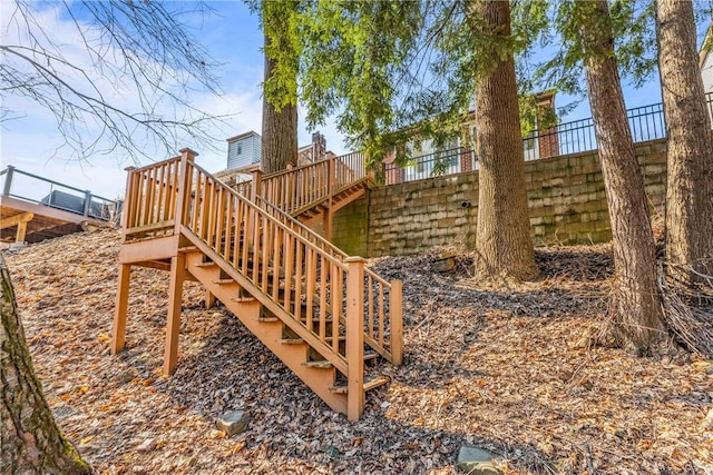 view of yard featuring stairway, fence, and a wooden deck