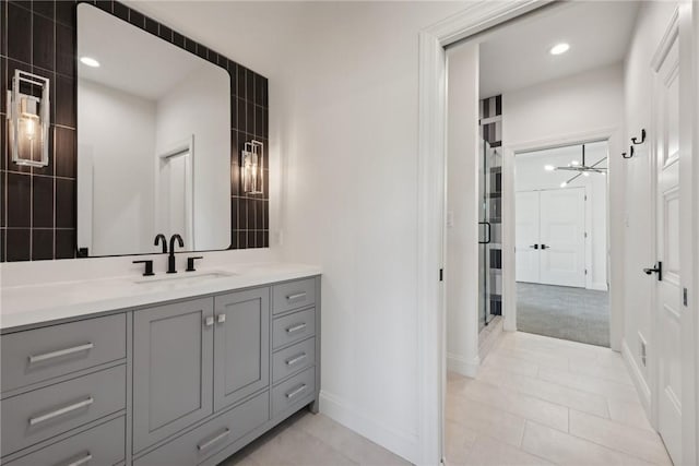 full bath featuring vanity, baseboards, recessed lighting, a stall shower, and tile patterned floors