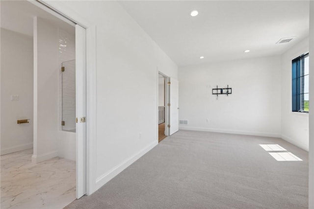 unfurnished room with recessed lighting, visible vents, baseboards, and carpet