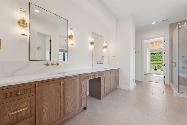 full bath featuring visible vents, a shower stall, double vanity, tile patterned floors, and a sink