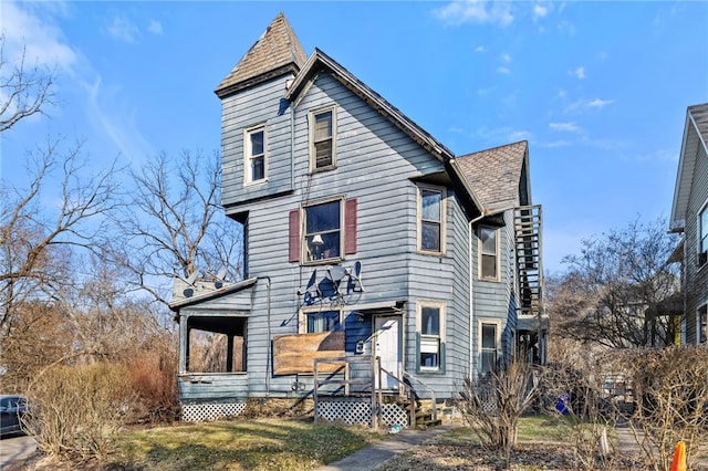 victorian-style house with a shingled roof