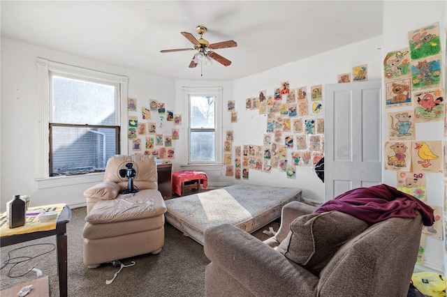 living area featuring ceiling fan