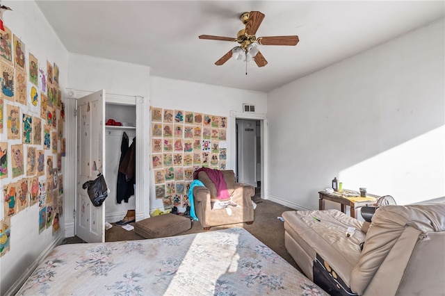 bedroom featuring baseboards, visible vents, carpet floors, ceiling fan, and a closet