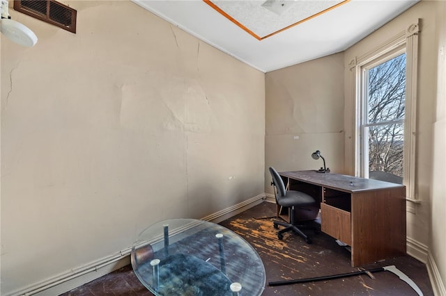 office featuring baseboards and visible vents