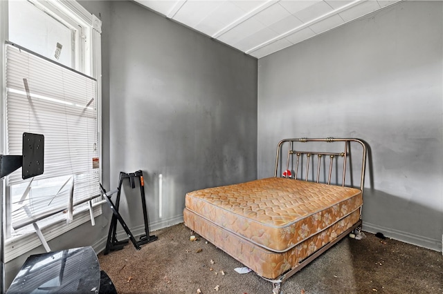 bedroom featuring baseboards