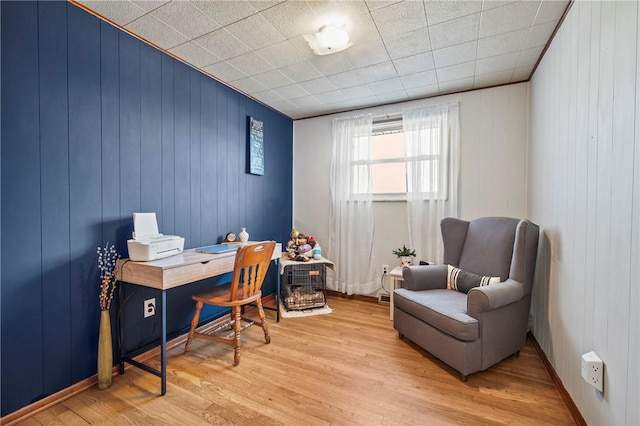 office with light wood-style flooring