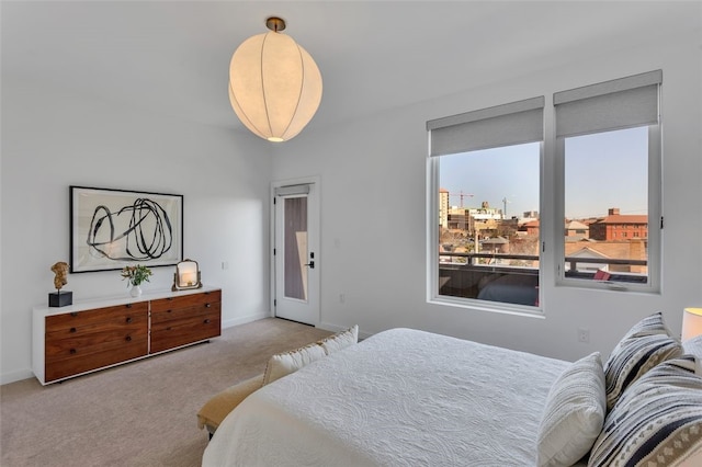 bedroom with baseboards and carpet floors