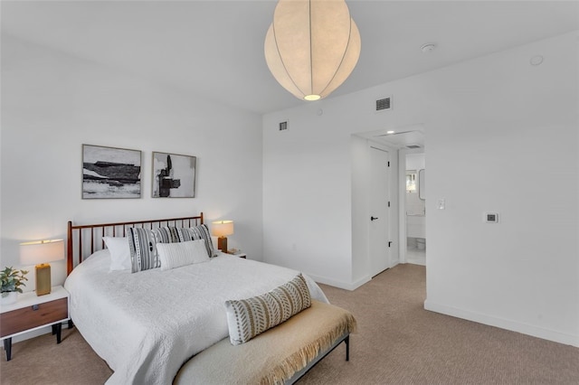 carpeted bedroom featuring visible vents and baseboards