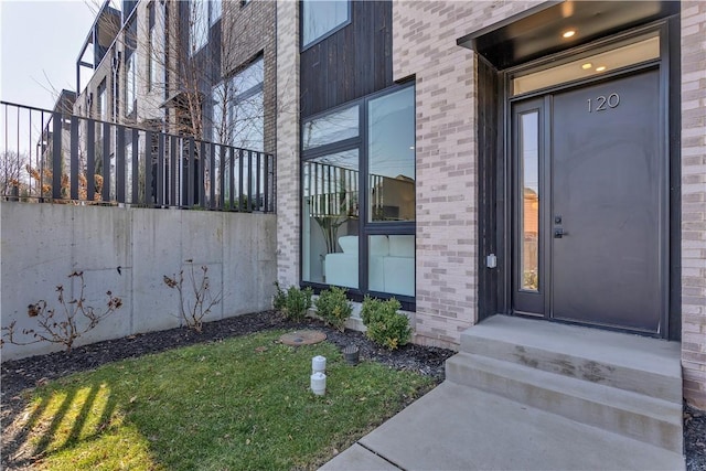 entrance to property with brick siding