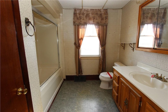 full bathroom with vanity, baseboards, wallpapered walls, tile patterned floors, and toilet