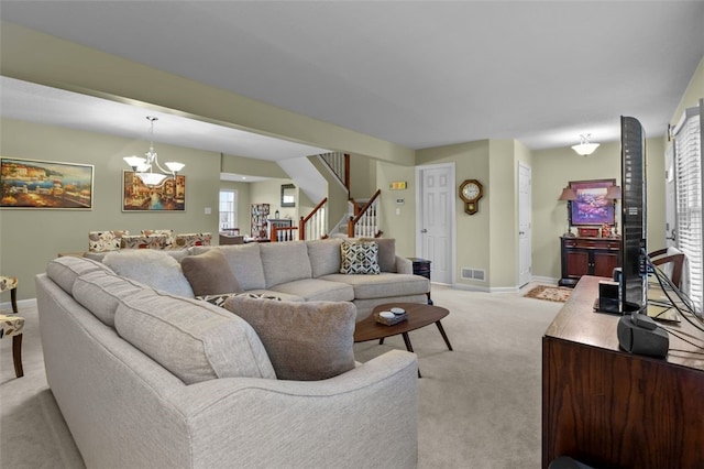 living room with visible vents, baseboards, light colored carpet, stairs, and a notable chandelier