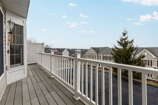 wooden deck with a residential view