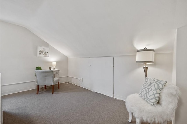 sitting room featuring lofted ceiling and carpet floors