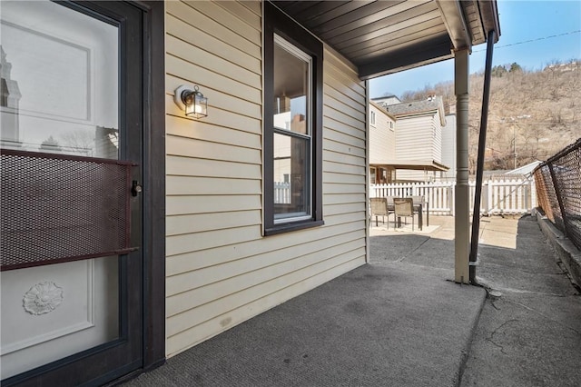 view of patio / terrace with outdoor dining area and fence