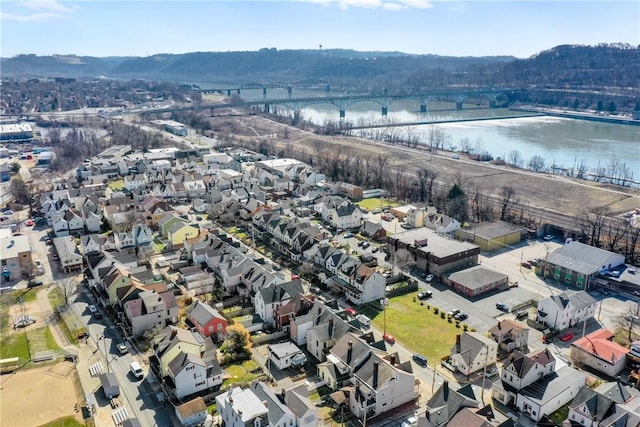 birds eye view of property featuring a water view and a residential view